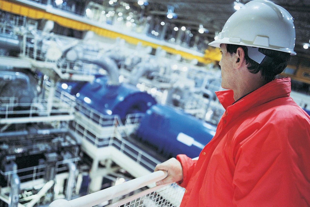 Employee looking at factory