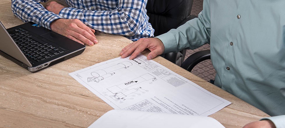 Employees looking at drawing